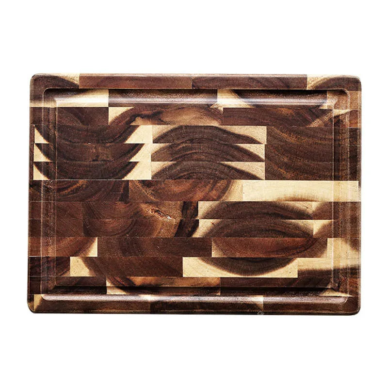 Brown solid acacia wood cutting board with 3cm thickness on a kitchen counter.