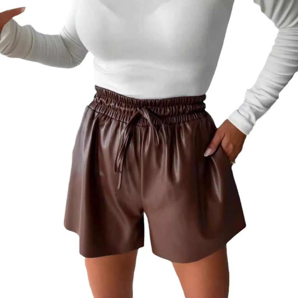 Women's black wide-leg shorts with a lace-up drawstring waist and straight-leg cut.