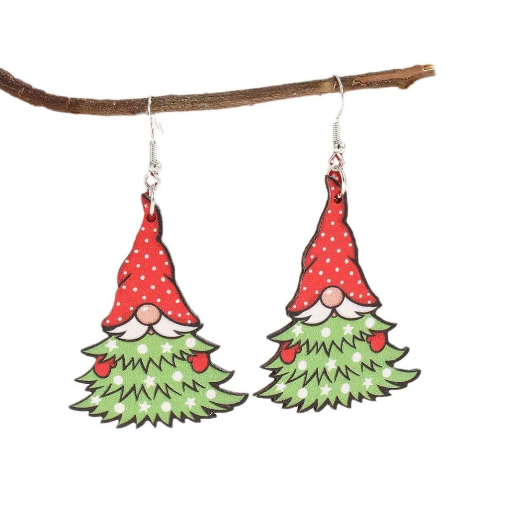 Wooden Christmas earrings with geometric shapes showing printed tree and snowman designs