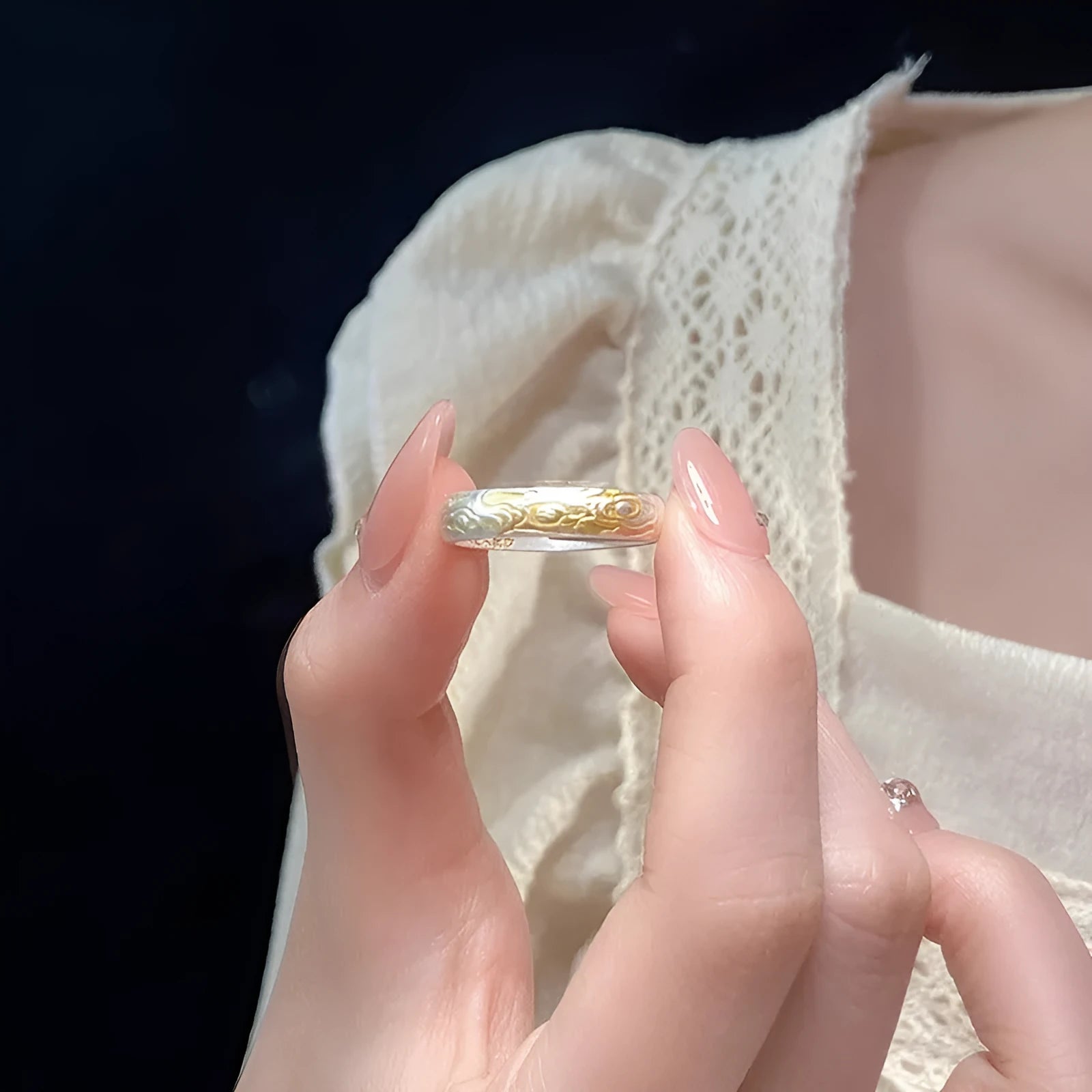 Open-mouth geometric ring with engraved xiangyun pattern in electroplated white copper showing silver and gold finish options