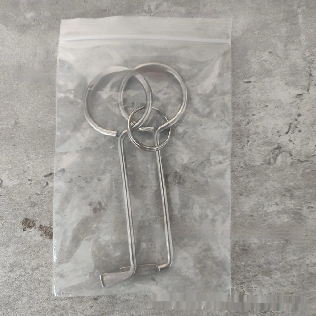 Two alloy wrench tools from portable maintenance set on plain background