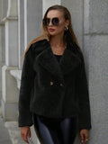 A rose red women's short faux fur coat with a loose fit and regular sleeves on a hanger.