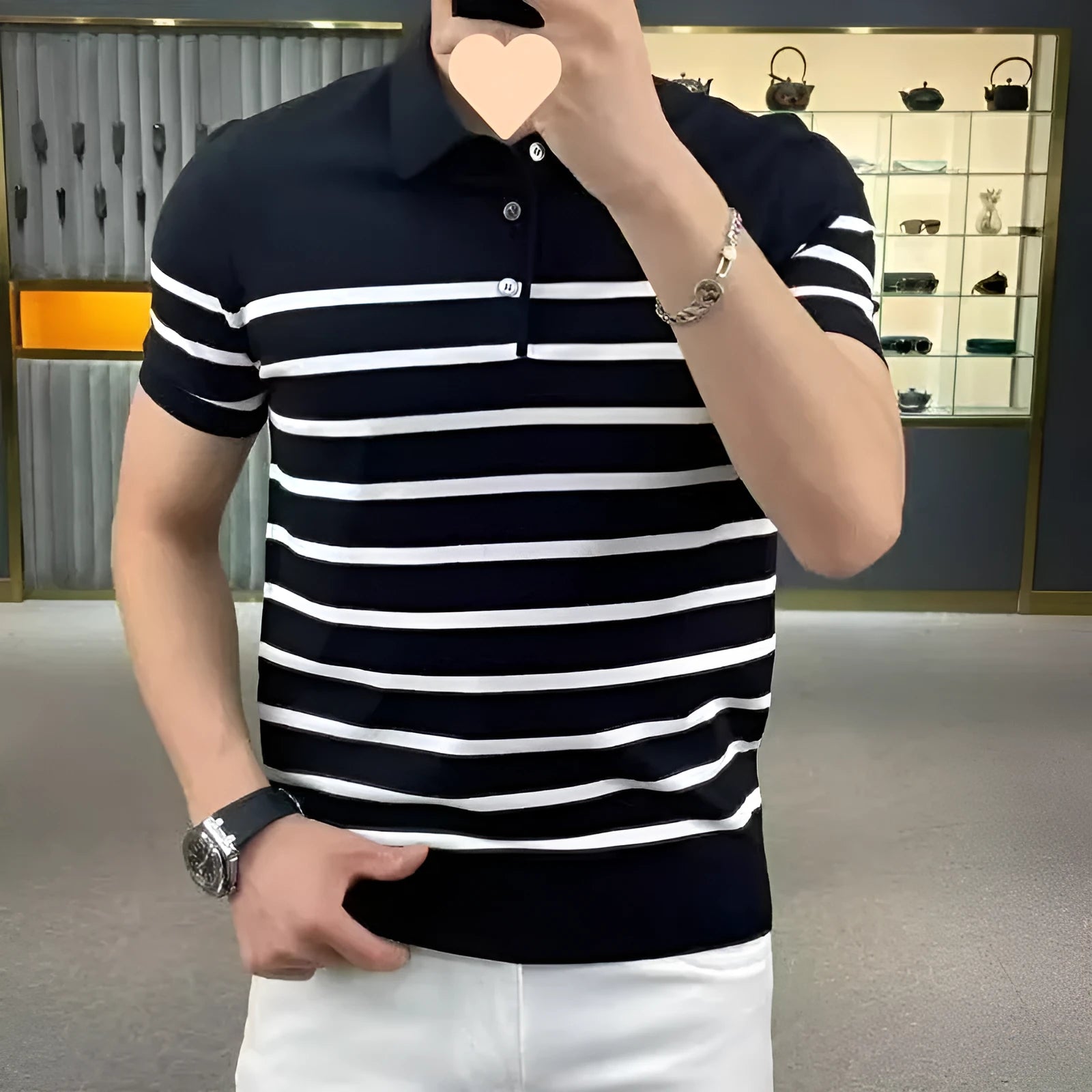 Black and white striped lapel knitted t-shirt laid flat, showing pullover style and non-ironing finish.