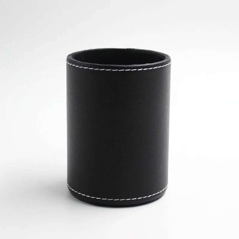 Round black leather pen container with 8.0cm diameter on wooden desk