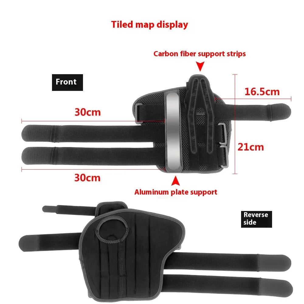 Black and grey carbon fibre sports wrist guard with thumb strap shown on a hand.