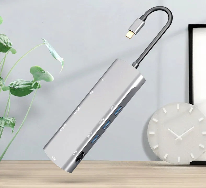 Grey aluminium USB-C docking station with HDMI, VGA, and USB ports