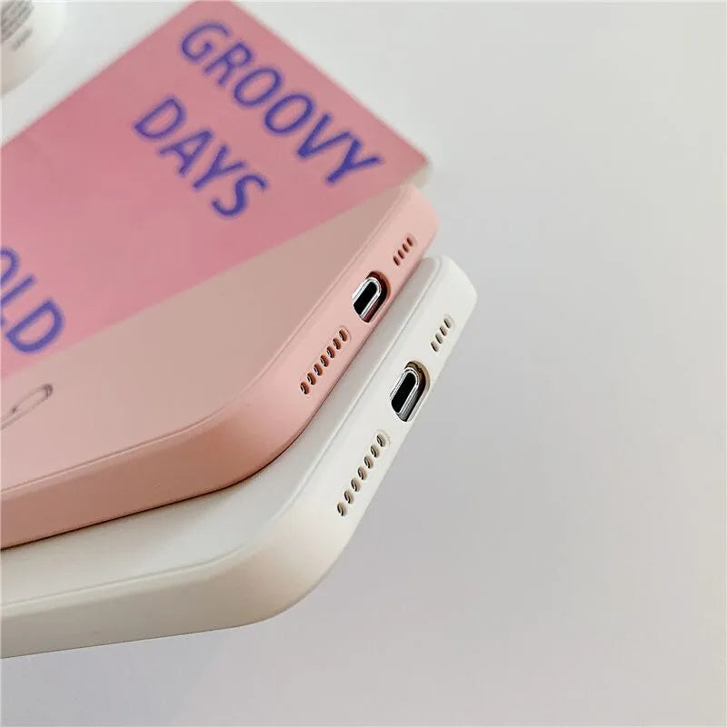 Solid colour TPU silicone back cover case for Apple iPhone on a table.