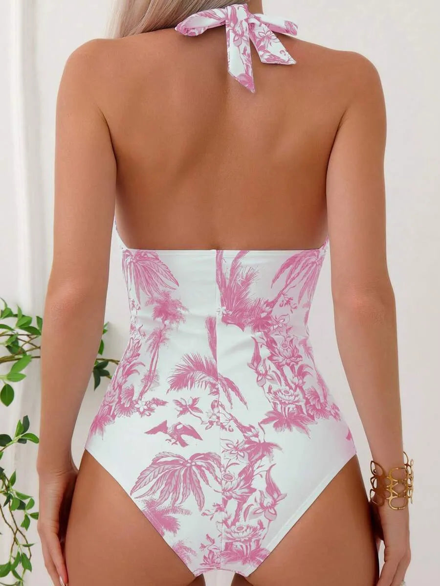 Women's black coconut tree print V-neck one-piece swimsuit made from polyester.