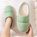 Blue couple's winter slippers with artificial leather upper, plush lining, and thick rubber anti-slip sole.