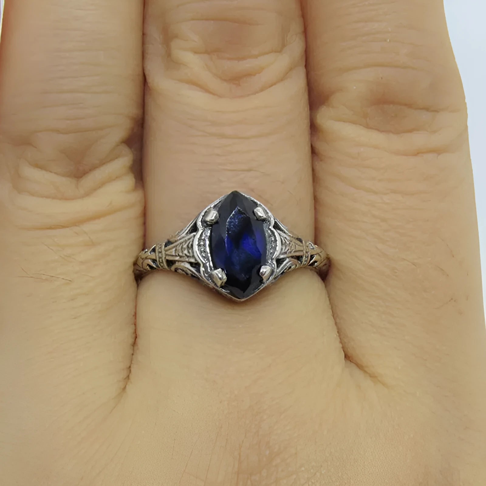 Silver women's geometric hollow ring with zircon accents on alloy band