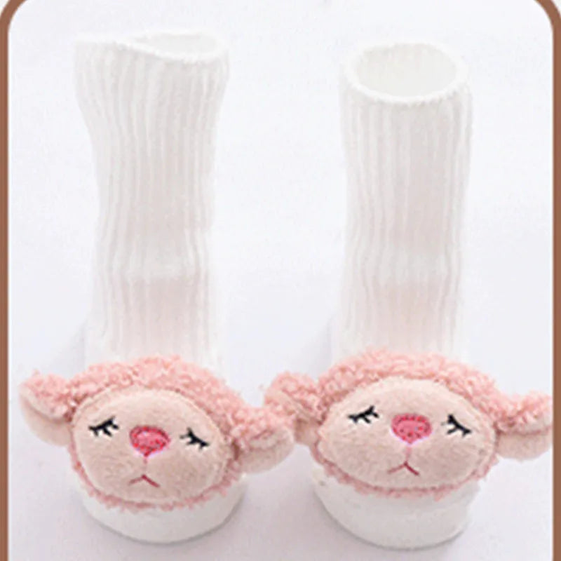 Cotton baby floor socks in various designs including blue bow and lion, showing sizes for infants 0-3 months