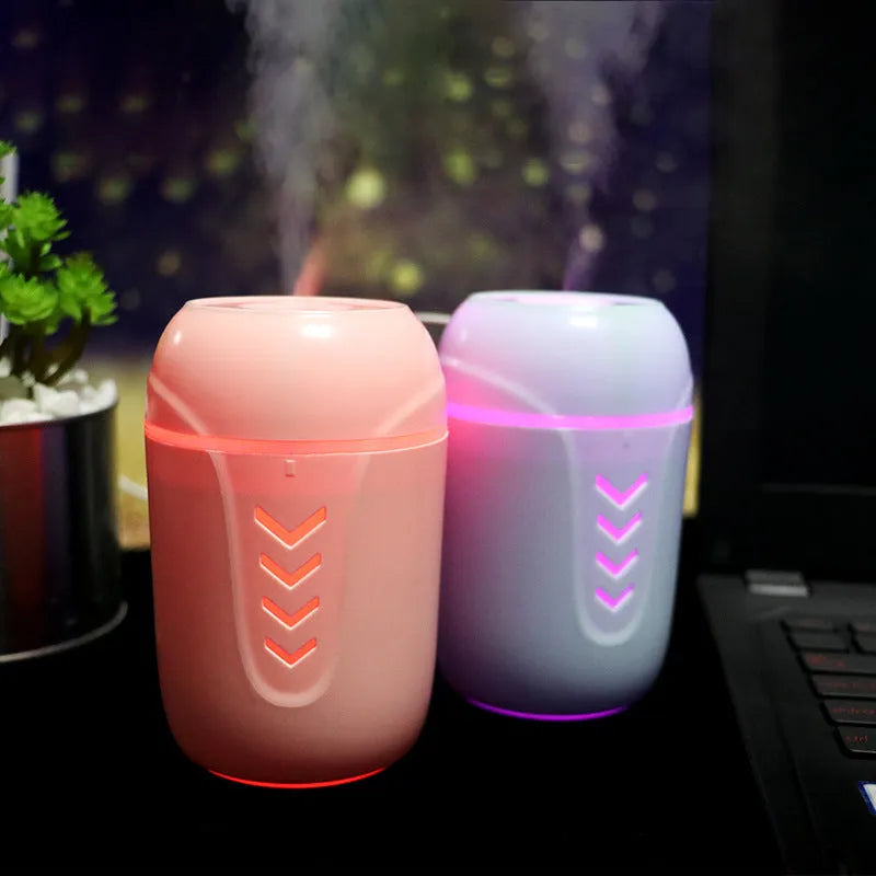 Blue X3 portable columnar humidifier with USB cable on a car dashboard.