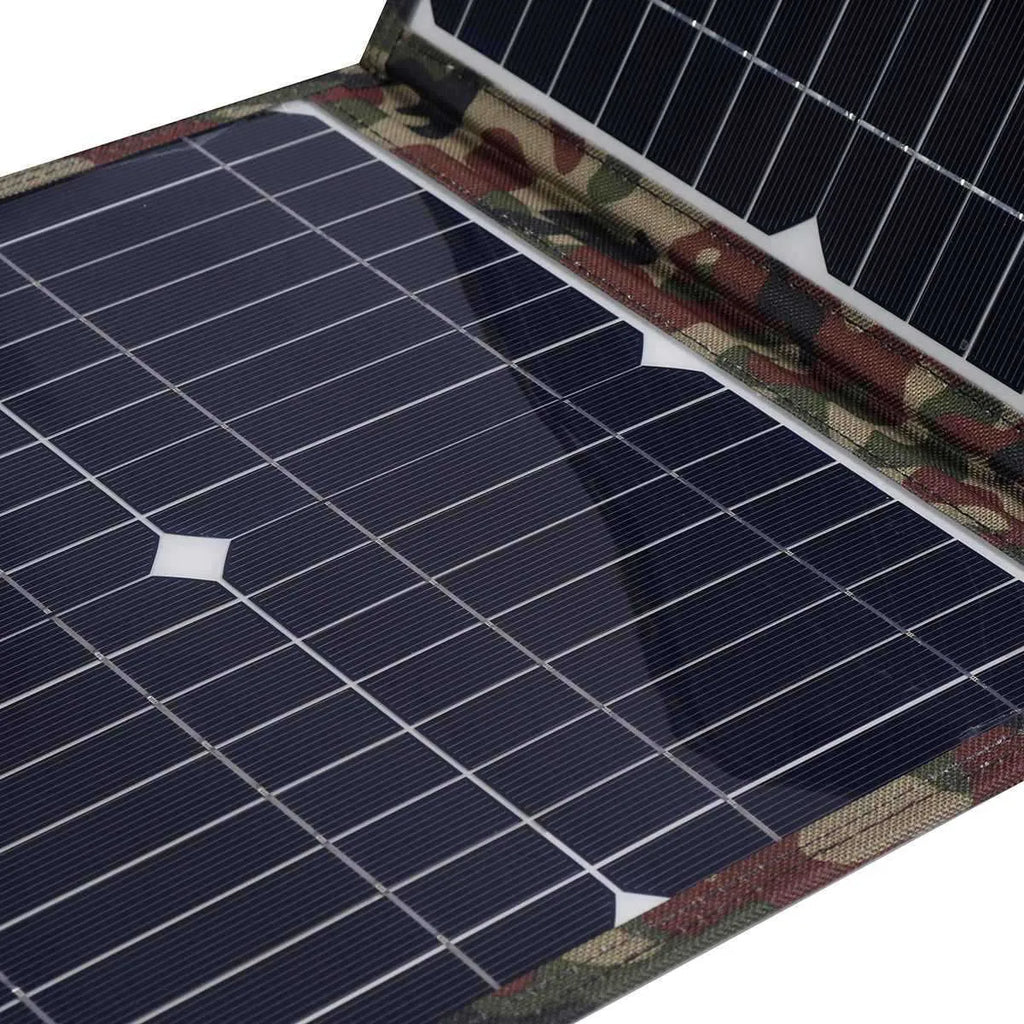 Black foldable 36W solar panel open showing three monocrystalline silicon cells with charging accessories