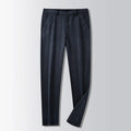 British retro striped straight-leg men's trousers in khaki colour on a hanger.