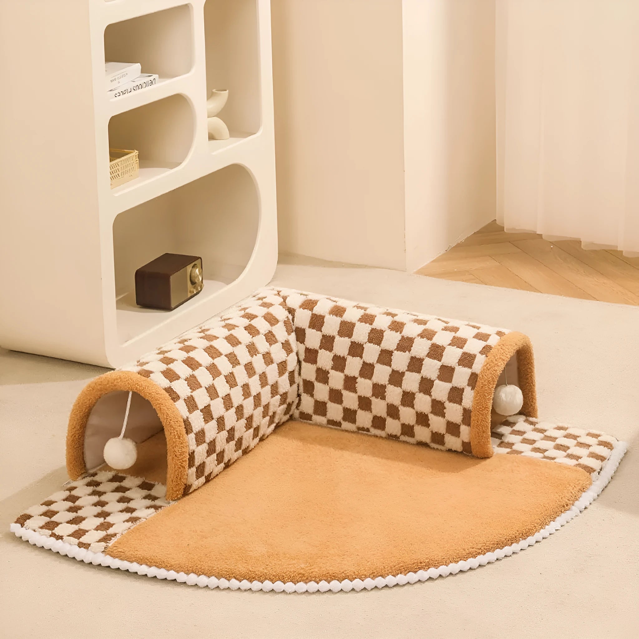 A plush fan-shaped dog and cat bed with an integrated tunnel, shown in a yellow plaid design.