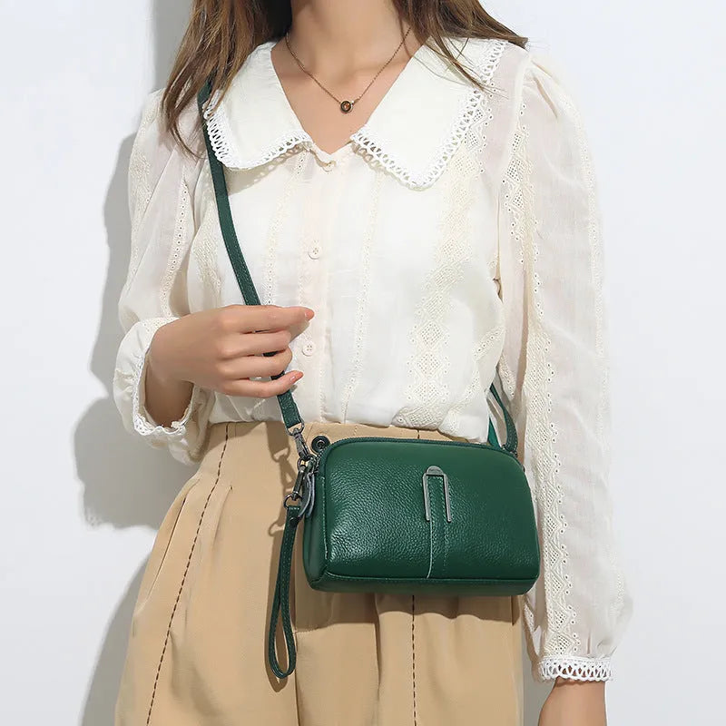 Square genuine leather ladies shoulder bag in dark khaki colour showing structured silhouette.