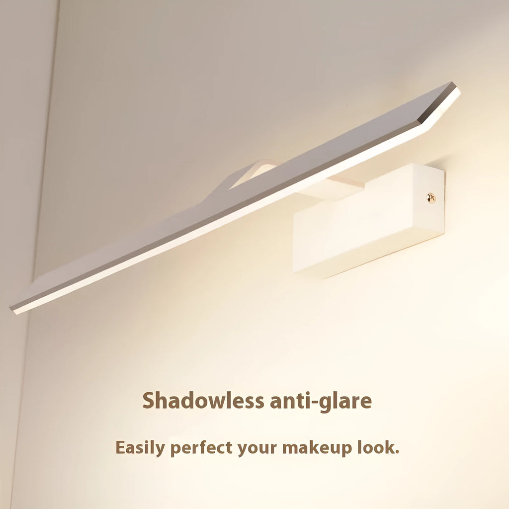 A white rectangular LED bathroom wall mirror with integrated dimmable tri-colour lighting, shown at 580mm long.