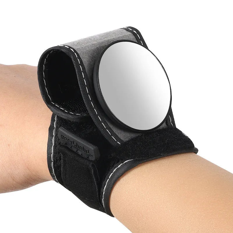 Black wrist-mounted bicycle rear-view mirror showing nylon construction and adjustable viewing angle