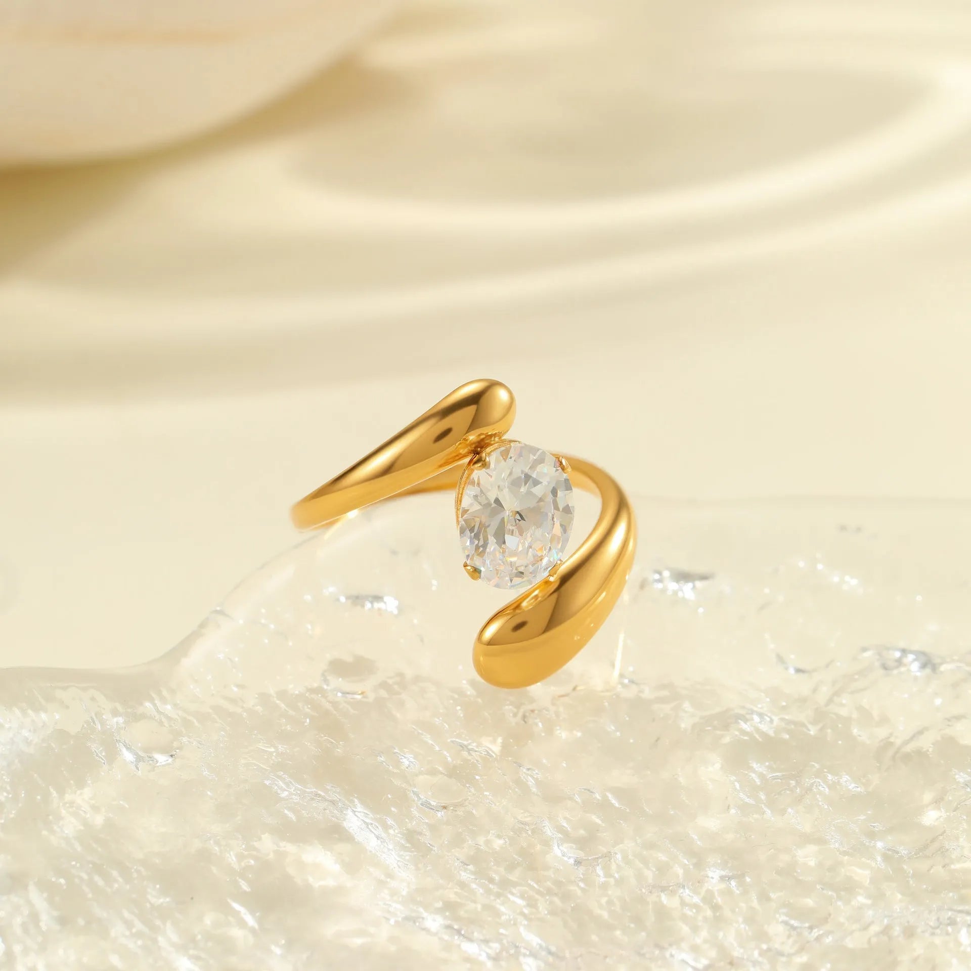 Geometric zircon ring with stainless steel construction and open mouth design in electroplated finish