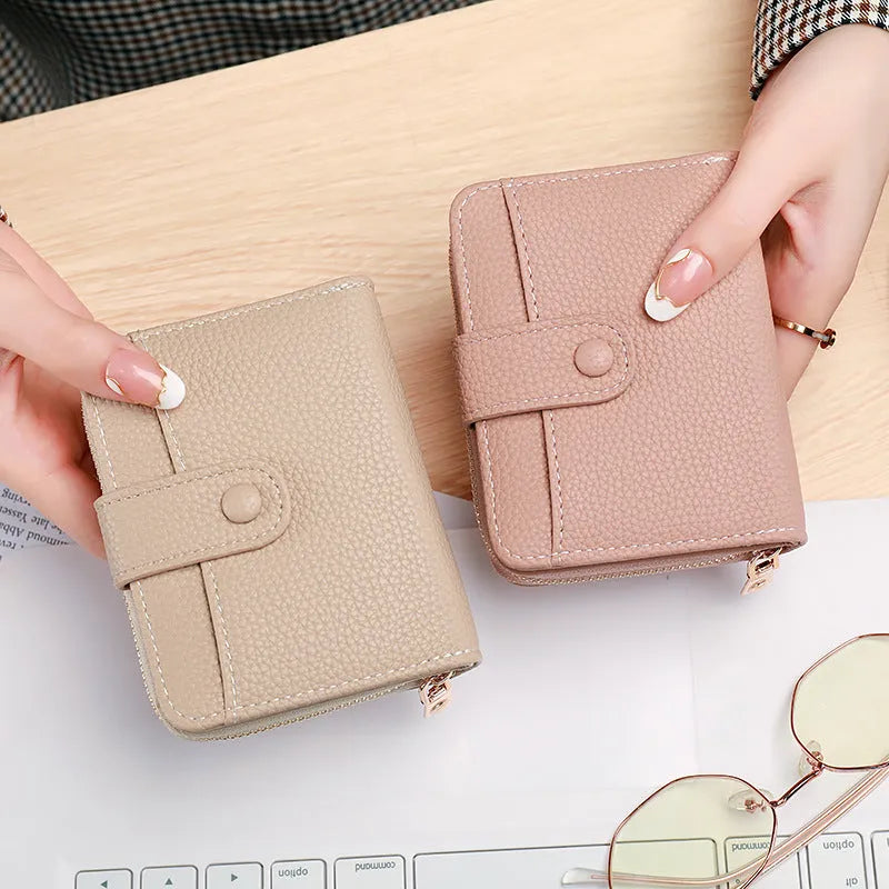 Ladies short wallet with lychee pattern in PU leather showing 2-fold design