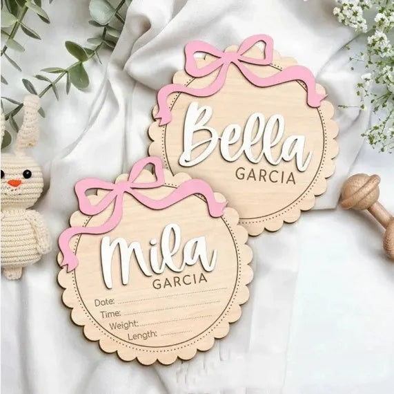 Customised square wooden baby ornament with a name for birthday or holiday decoration.
