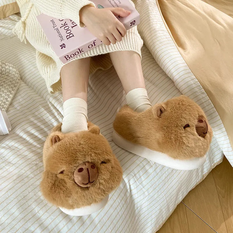 Light brown women's winter slippers with cartoon pattern, plush upper, and round toe.