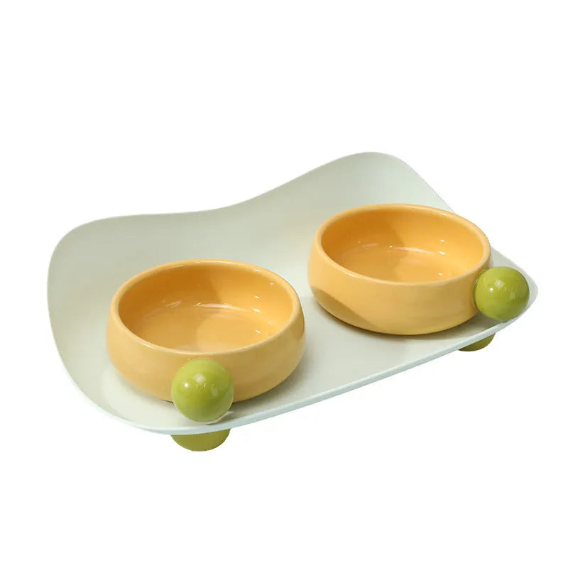 Ceramic double raised feeding bowl set for cats with non-slip support in pink, yellow, or pink yellow colour options