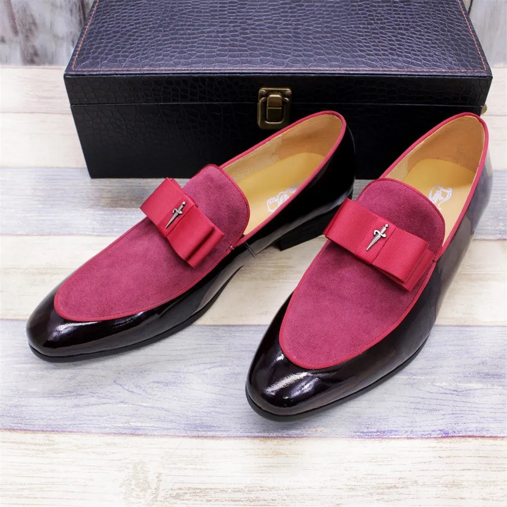 Men's black patent leather dress shoes with a tassel detail and low-top design on a rubber sole.