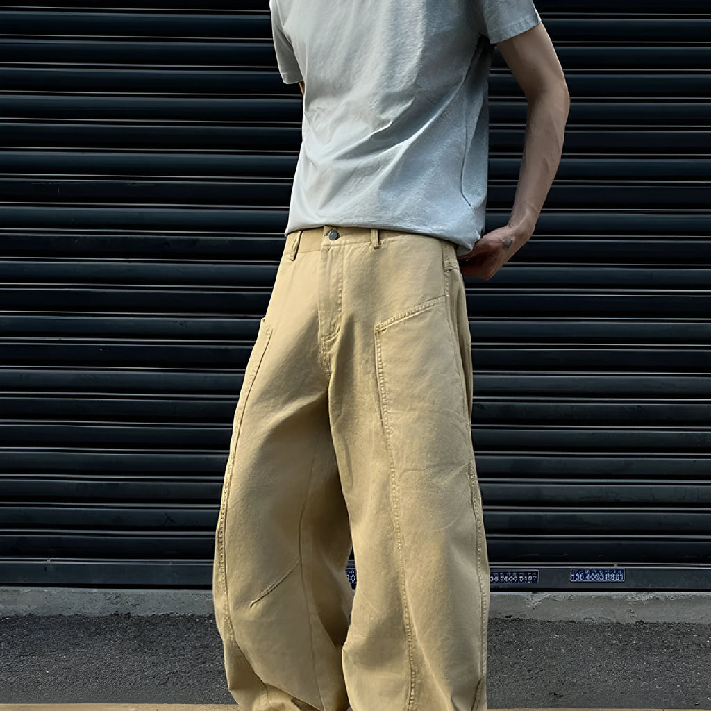 Men's khaki-coloured straight-leg cotton trousers laid flat, showing American retro casual style.