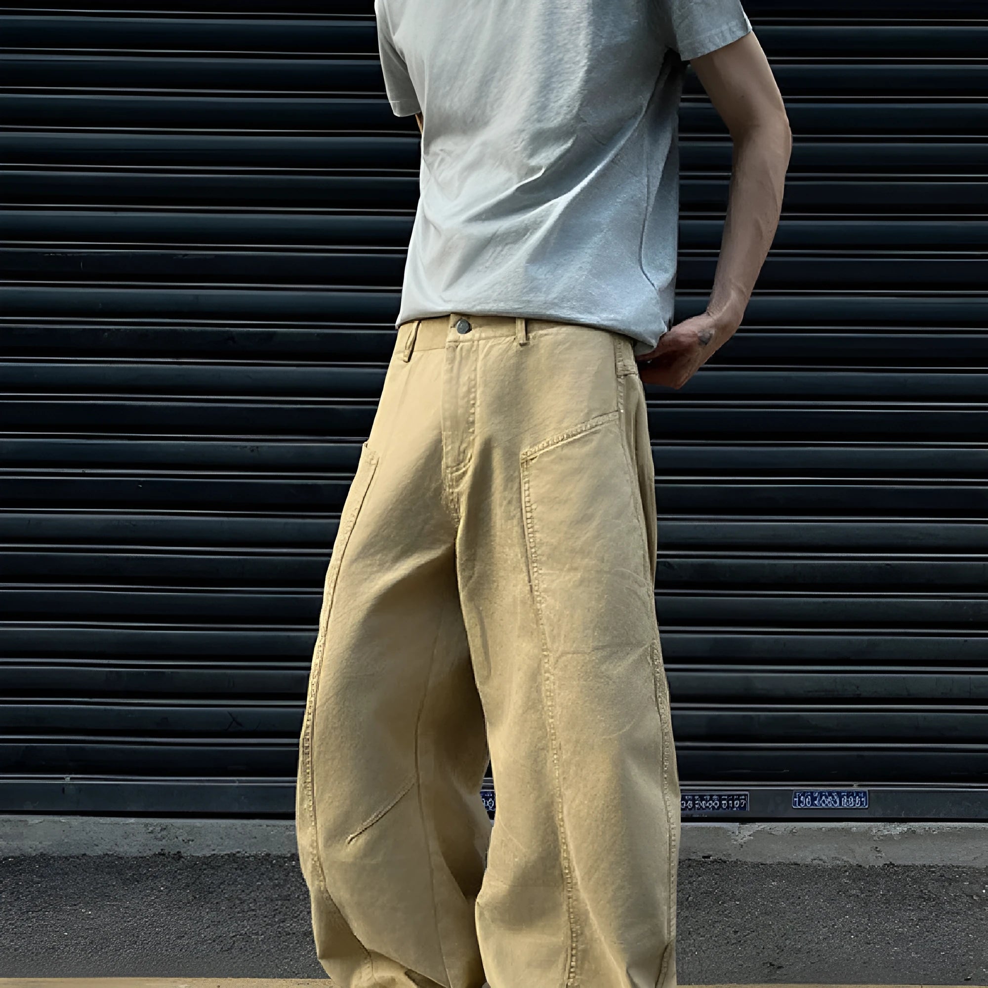 Men's khaki-coloured straight-leg cotton trousers laid flat, showing American retro casual style.