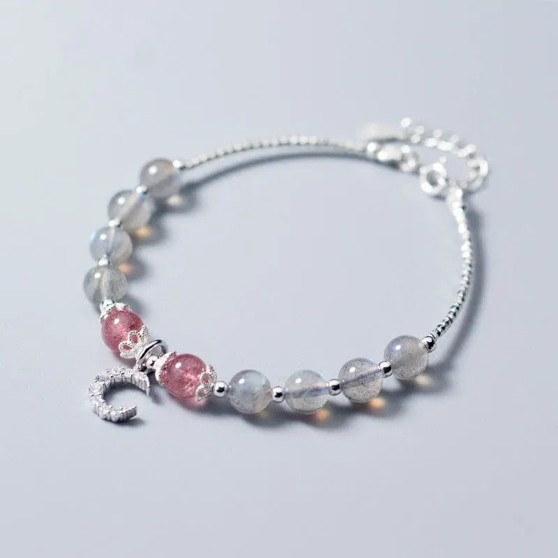 Moonstone handmade bracelet with crescent moon charm and adjustable extension chain.