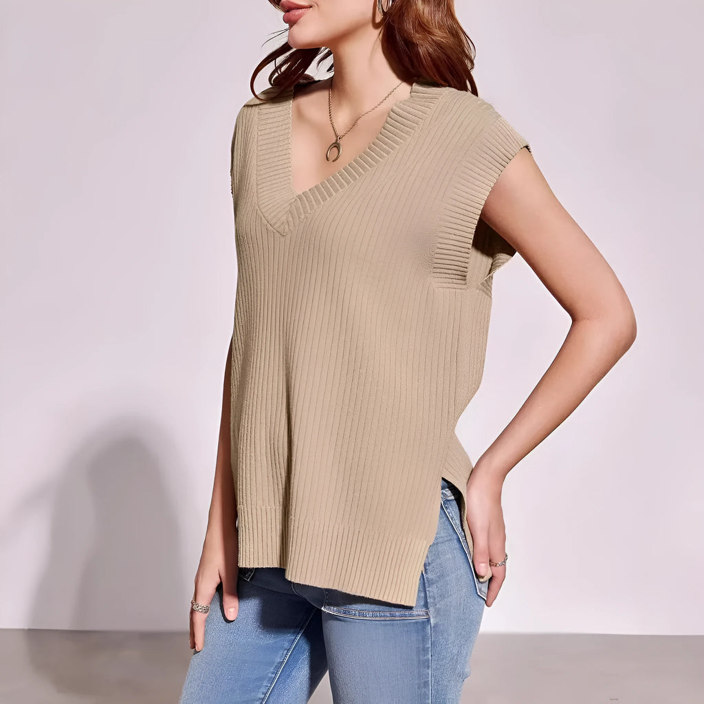 A woman's camel-coloured loose V-neck sleeveless vest with a thin striped pattern, laid flat.