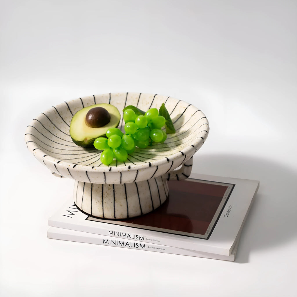 Black and white striped retro synthetic resin dessert plate on a table.