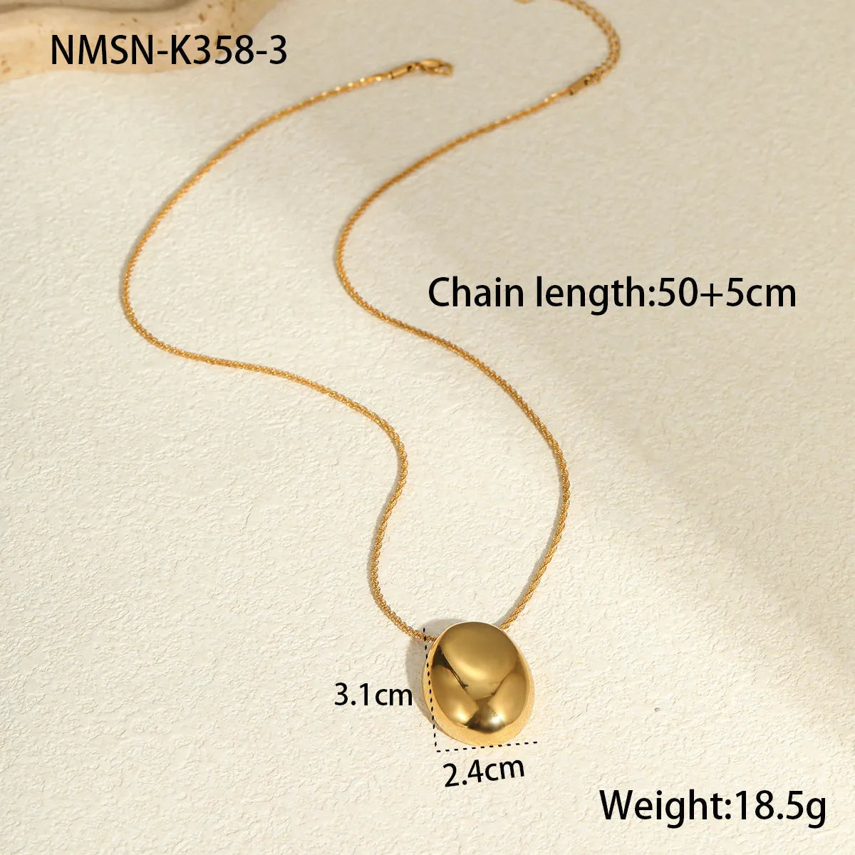 Gold geometric pendant necklace with regular chain on black background showing 41-50cm length