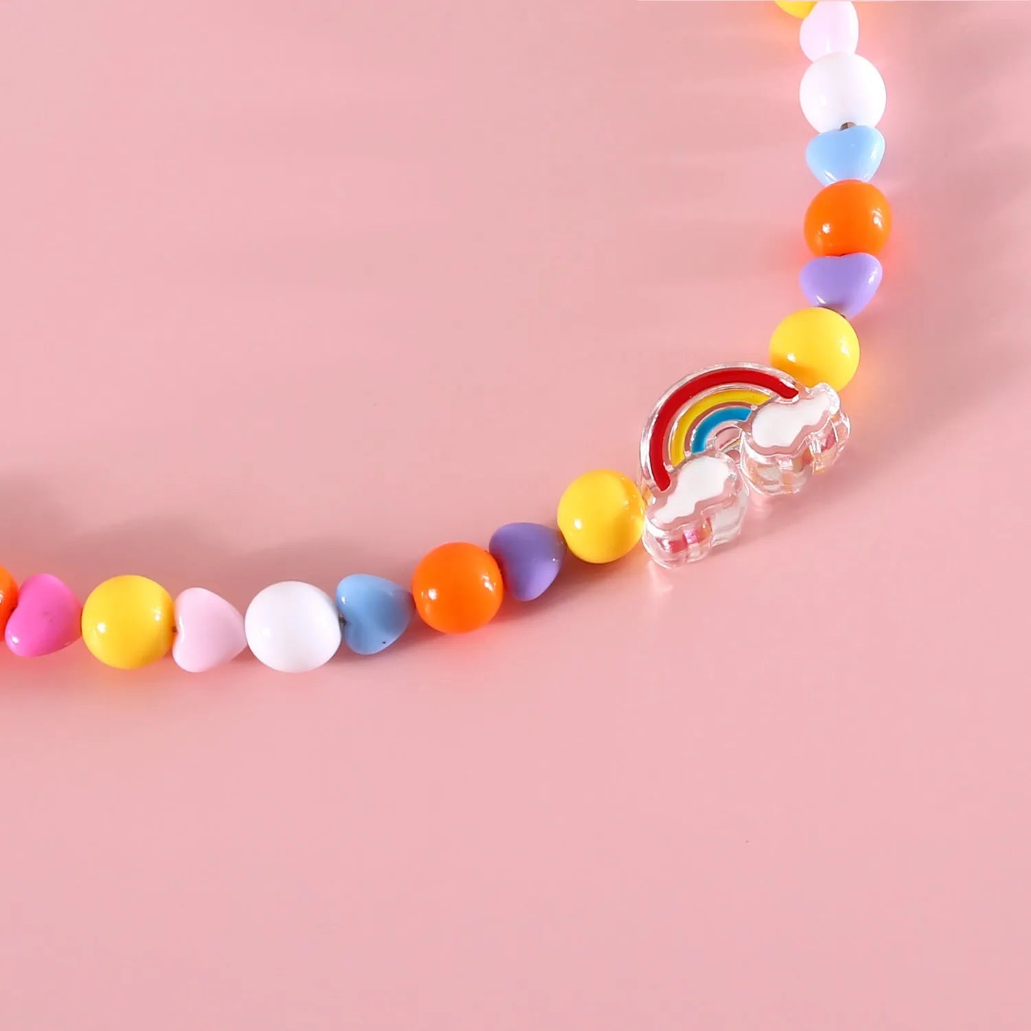 Colourful plastic bead cat necklace with adjustable sizing in peach, rainbow, and small flower patterns