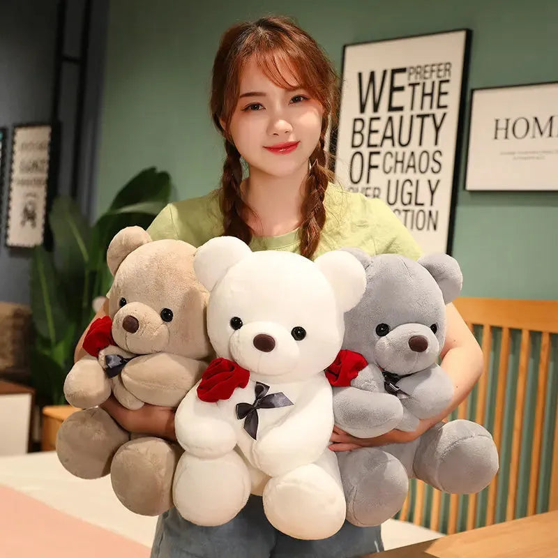 Rose bear plush toy in beige, brown, or grey, shown in sizes from 23cm to 45cm.