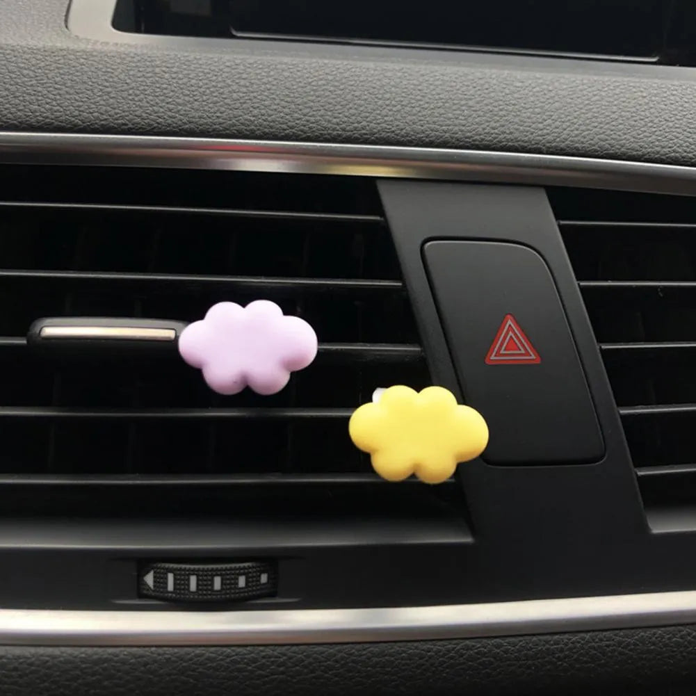 Resin cartoon car fragrance clip in light green colour mounted on car air vent