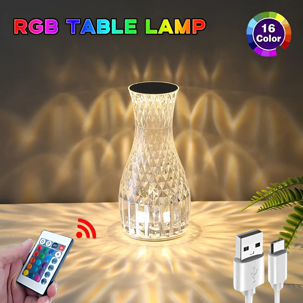 Vase-shaped crystal table lamp with LED lights and remote control on wooden bedside table