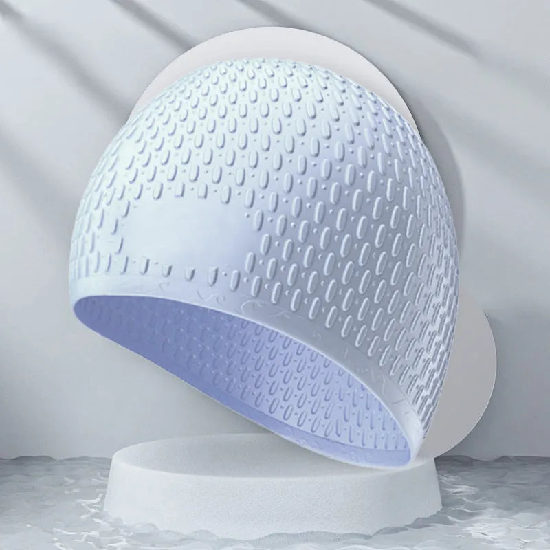 Solid colour silicone swimming cap for adults shown in various colours including Tiffany Blue and Matcha Green.