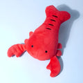 Red lobster shaped squeaky dog toy with crab claw details for small medium dogs
