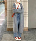 Women's knitted mid-length cardigan with V-neck in khaki colour showing loose fit design