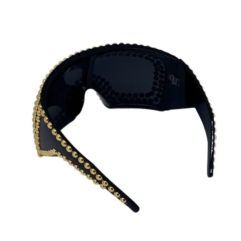 Square frame sunglasses with large rim and punk rivet decoration in silver finish
