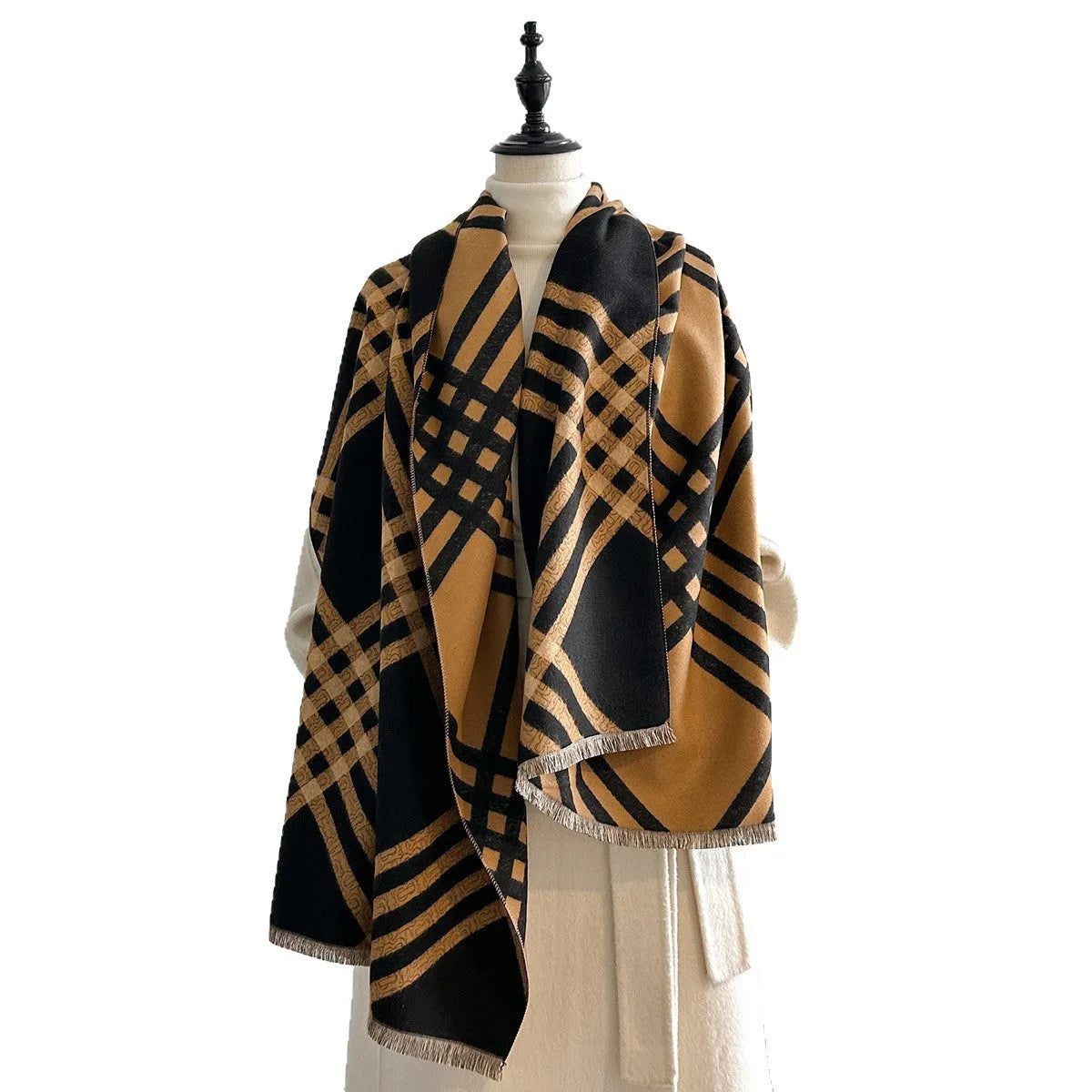 Mid-length brown cashmere-like scarf with tassel ends laid flat.
