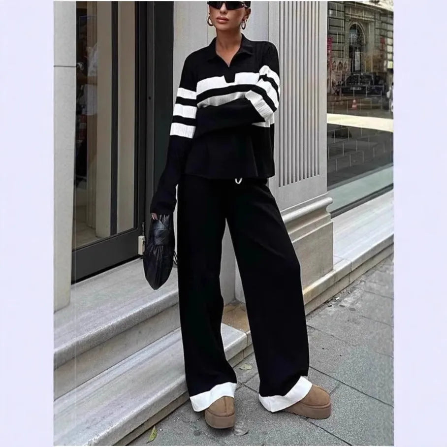 Women's black and white striped knitted two-piece set with polo collar shirt and matching trousers