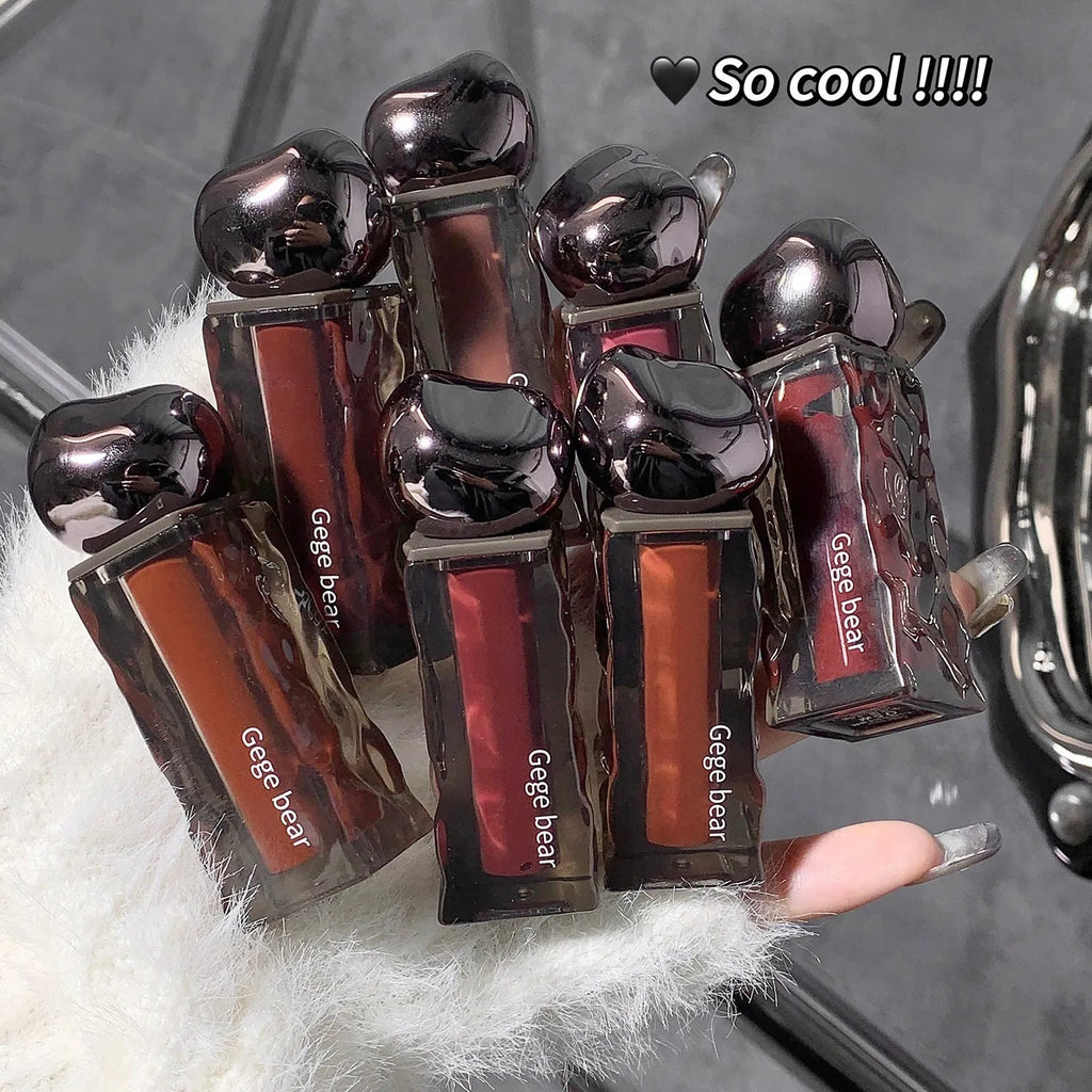 Glacier Lava Lip Lacquer in a tube showing its shiny, mirror finish with seven colour options from 01 to 07.