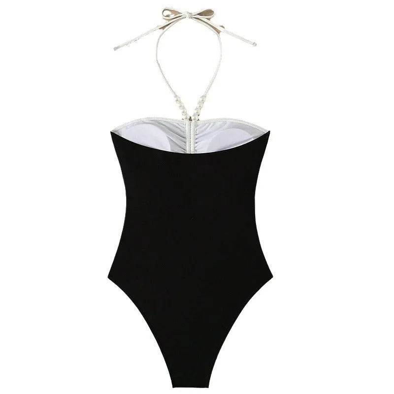 Black and white women's sleeveless one-piece swimsuit with slim fit and spaghetti straps