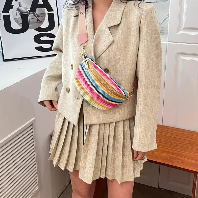 Bohemian style straw beach bag for women in shell shape with single strap and zipper closure available in pink or blue