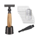 Men's copper safety razor with olive wood handle, blade holder stand, and shaving accessories