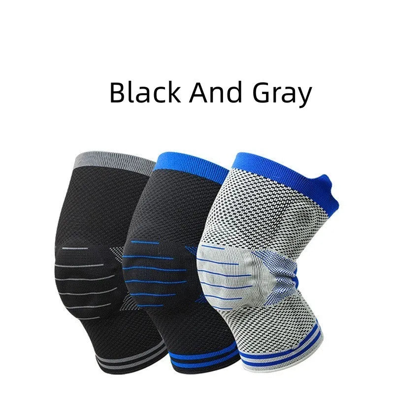 A cotton knee pad with a visible silicone massage spring bar shock absorber, shown in a grey and blue colour combination.