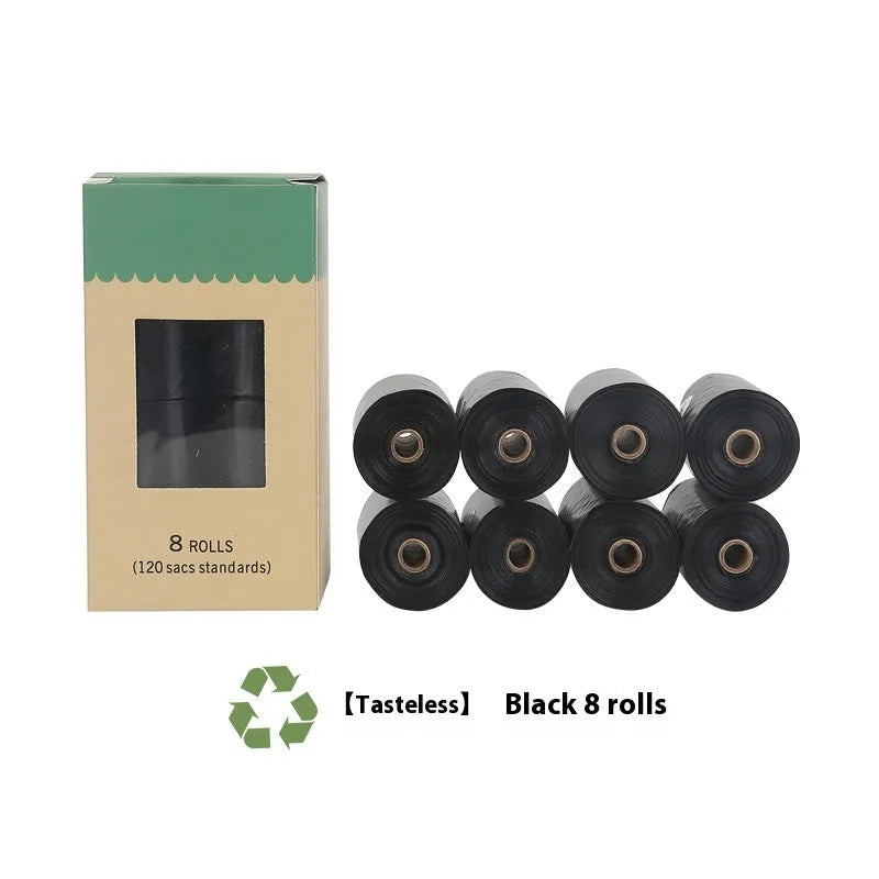 Roll of green EPI degradable dog poop bags next to a white dispenser on a table.